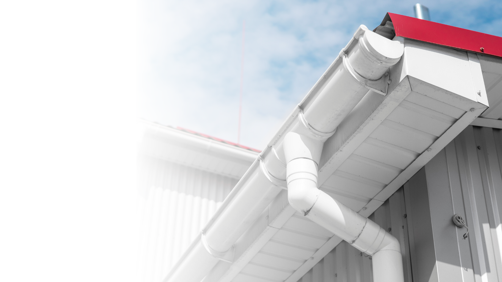 An image of a clean commercial gutter, fascia and soffit